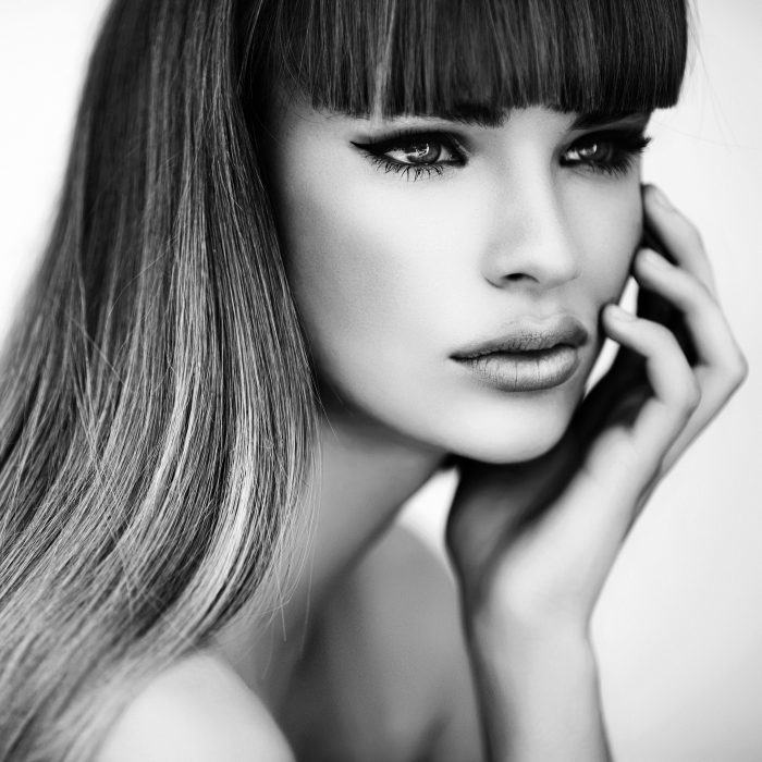 B&W studio shot of young beautiful woman